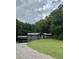 Charming home with well-maintained lawn and mature trees, perfect for serene living at 4023 Anvil Block Rd, Ellenwood, GA 30294