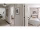Hallway view showcasing a bedroom with twin beds and view to the living room at 4023 Anvil Block Rd, Ellenwood, GA 30294