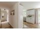 Open kitchen features white cabinets, stainless steel appliances, and wood floors at 4023 Anvil Block Rd, Ellenwood, GA 30294