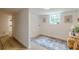 Bright laundry room features a patterned rug, window, and ample space at 4023 Anvil Block Rd, Ellenwood, GA 30294