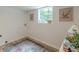 Laundry room featuring a window, patterned rug, and neutral wall colors at 4023 Anvil Block Rd, Ellenwood, GA 30294