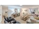 Bright living room featuring neutral tones, layered textures, and an open entryway to other rooms at 4023 Anvil Block Rd, Ellenwood, GA 30294