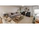 Inviting living room featuring a comfortable gray sofa, stylish decor, and a cozy atmosphere at 4023 Anvil Block Rd, Ellenwood, GA 30294