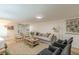 Cozy living room with comfortable seating, stylish decor, and ample natural light at 4023 Anvil Block Rd, Ellenwood, GA 30294