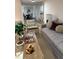 Cozy living room featuring a comfortable couch, wood accents, and warm natural light at 4023 Anvil Block Rd, Ellenwood, GA 30294