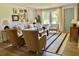 Cozy living room with neutral colors, ample seating, and stylish decor at 4023 Anvil Block Rd, Ellenwood, GA 30294