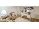 Bright office space with a white desk, cozy seating, and contemporary artwork at 4023 Anvil Block Rd, Ellenwood, GA 30294