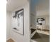 Stairway leading to a living space with artwork and natural lighting at 4023 Anvil Block Rd, Ellenwood, GA 30294
