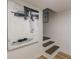 Modern staircase with contemporary artwork and stylish lighting at 4023 Anvil Block Rd, Ellenwood, GA 30294