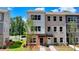 Charming new townhome with mixed brick and siding and a well manicured front yard at 5463 Blossomwood Sw Trl, Mableton, GA 30126