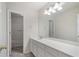This bathroom features a bathtub, neutral color palette, and lots of counter space at 10775 Brunson Dr, Johns Creek, GA 30097
