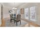 Elegant dining room with hardwood floors, chandelier, and French doors leading to an outdoor space at 10775 Brunson Dr, Johns Creek, GA 30097