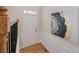 Bright entryway featuring hardwood floors, modern decor, and a view of the staircase at 10775 Brunson Dr, Johns Creek, GA 30097