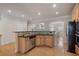 Well-equipped kitchen with stainless steel appliances, granite countertops, and a convenient breakfast bar at 10775 Brunson Dr, Johns Creek, GA 30097