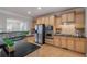 Modern kitchen featuring stainless steel appliances, granite countertops, and ample cabinet space at 10775 Brunson Dr, Johns Creek, GA 30097