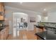 Bright kitchen with stainless appliances, breakfast bar and adjacent dining area at 10775 Brunson Dr, Johns Creek, GA 30097