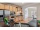 Modern kitchen with stainless steel appliances and a view into the dining area at 10775 Brunson Dr, Johns Creek, GA 30097