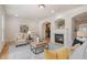 Cozy living room featuring a fireplace and comfortable seating at 10775 Brunson Dr, Johns Creek, GA 30097