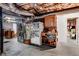 Unfinished basement area with washer, dryer, cabinets, shelving, and a small serving area at 1209 Colony Cir, Marietta, GA 30068