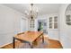 Bright dining room with hardwood floors, a chandelier, and built-in cabinets perfect for entertaining at 1209 Colony Cir, Marietta, GA 30068