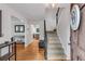 Inviting foyer features hardwood floors, staircase, and stylish decor at 1209 Colony Cir, Marietta, GA 30068
