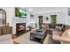 Cozy living room featuring a fireplace, recessed lighting, and a comfortable couch for relaxation at 1209 Colony Cir, Marietta, GA 30068