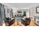Elegant living room showcasing hardwood floors, large windows, and a stylish seating arrangement at 1209 Colony Cir, Marietta, GA 30068