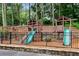 Fun playground with slides, swings, and climbing structures, set in a natural wooded area at 1209 Colony Cir, Marietta, GA 30068