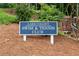 Lake Colony Swim & Tennis Club sign with mature trees and landscaping at 1209 Colony Cir, Marietta, GA 30068
