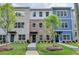 Townhomes with brick and siding exteriors, landscaped yards, and sidewalks at 5477 Blossomwood Sw Trl, Mableton, GA 30126