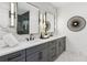 Sleek bathroom with double vanity, modern lighting, and stylish fixtures at 81 Walthall Se St, Atlanta, GA 30316