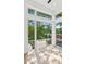 Sunlit room features large windows with neighborhood views and hardwood floors at 81 Walthall Se St, Atlanta, GA 30316