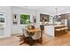 Dining area with modern table set and gray cabinets at 81 Walthall Se St, Atlanta, GA 30316