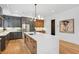Bright kitchen featuring a center island with seating and stainless steel appliances at 81 Walthall Se St, Atlanta, GA 30316