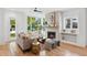 Cozy living room featuring a fireplace and large windows overlooking the yard at 81 Walthall Se St, Atlanta, GA 30316