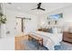 Bright main bedroom with a ceiling fan, ample natural light, and hardwood floors at 81 Walthall Se St, Atlanta, GA 30316