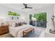 Light-filled main bedroom features a ceiling fan, balcony access, and serene views at 81 Walthall Se St, Atlanta, GA 30316
