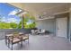 An open air patio features a dining table, a seating area and a ceiling fan at 81 Walthall Se St, Atlanta, GA 30316