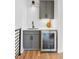 Stylish wet bar with custom cabinetry, quartz countertop, and a beverage refrigerator at 81 Walthall Se St, Atlanta, GA 30316