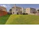 Spacious backyard with a covered patio and lush lawn, ideal for outdoor gatherings and relaxation at 110 Ashbury Circle Cir, Dallas, GA 30157