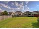 Large backyard with green grass and privacy fence, creating a serene outdoor space at 110 Ashbury Circle Cir, Dallas, GA 30157
