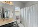 Cozy bathroom featuring a vanity, mirror, and shower with a polka-dot curtain at 110 Ashbury Circle Cir, Dallas, GA 30157