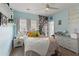 Bright bedroom features soft blue walls, large window and white wicker furniture at 110 Ashbury Circle Cir, Dallas, GA 30157