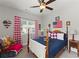Bedroom featuring a wood bed frame, patriotic decor and red and white checkered curtains at 110 Ashbury Circle Cir, Dallas, GA 30157