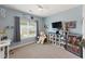 Bedroom with a large window, desk and entertainment center at 110 Ashbury Circle Cir, Dallas, GA 30157
