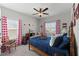 Comfortable bedroom featuring a full bed, red and white curtains, and carpeted floors at 110 Ashbury Circle Cir, Dallas, GA 30157