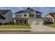 Charming two-story home with landscaped front yard, inviting porch, and a two-car garage at 110 Ashbury Circle Cir, Dallas, GA 30157