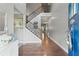 Inviting foyer with hardwood floors leading to a staircase and an open view into other rooms at 110 Ashbury Circle Cir, Dallas, GA 30157