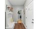 Hallway with hardwood flooring, leading to powder room and front door at 110 Ashbury Circle Cir, Dallas, GA 30157