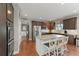 Open kitchen with granite countertops, stainless appliances, and hardwood floors at 110 Ashbury Circle Cir, Dallas, GA 30157